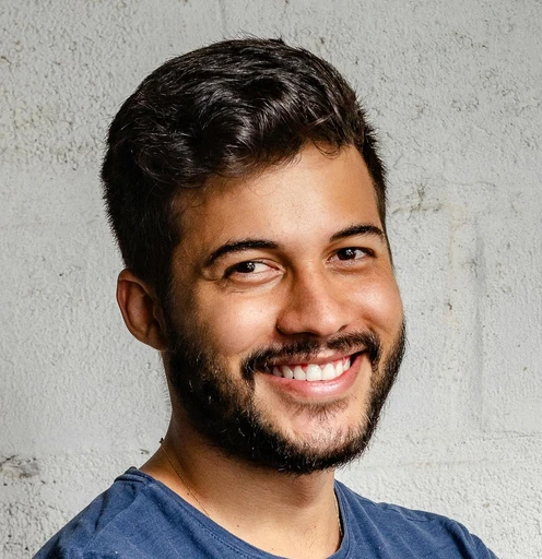 man in white crew neck shirt smiling