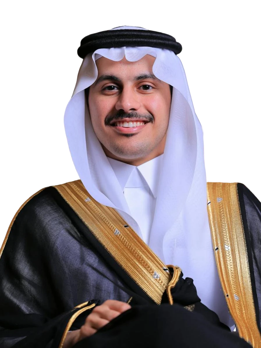 A couple of men standing next to each other on a beach