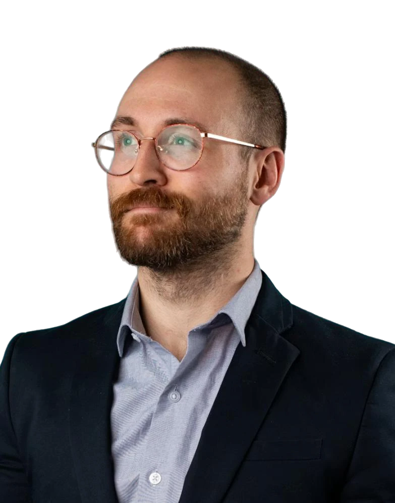 a man in a suit standing in a room