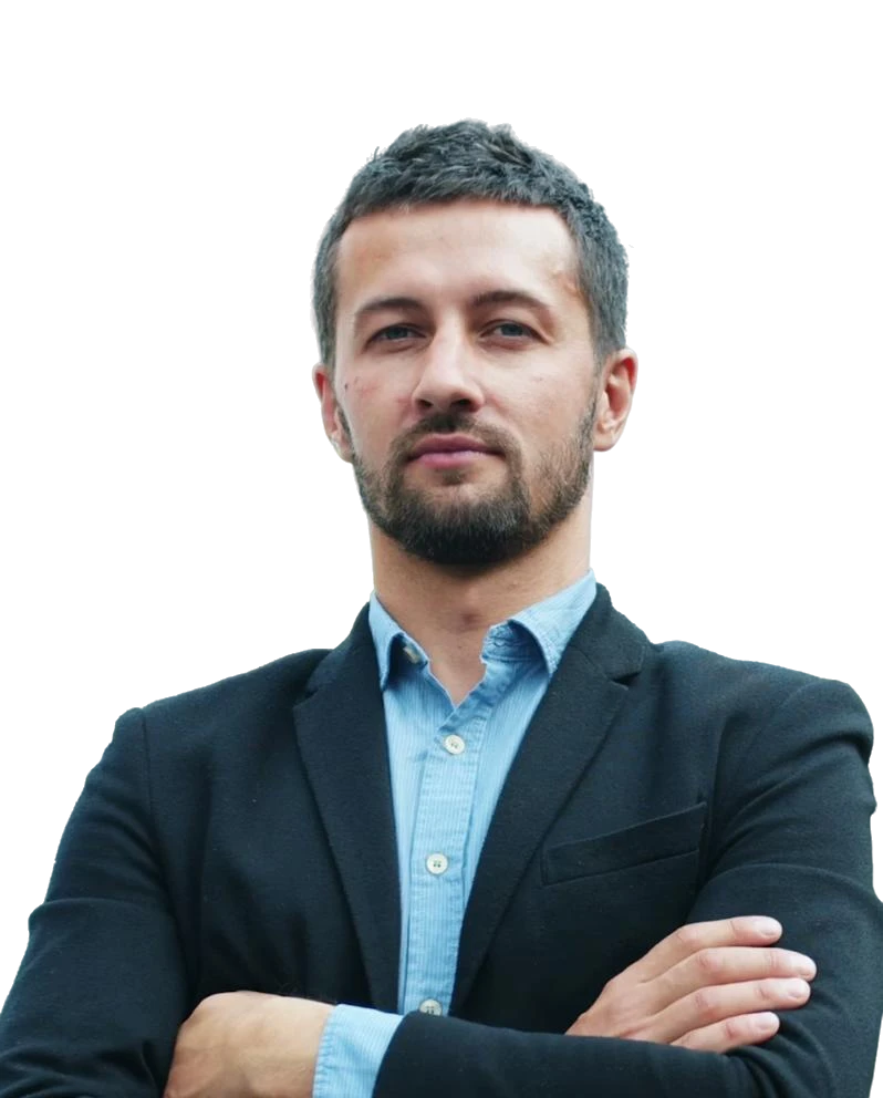 man wearing green crew-neck top and eyeglasses with black frames looking at side